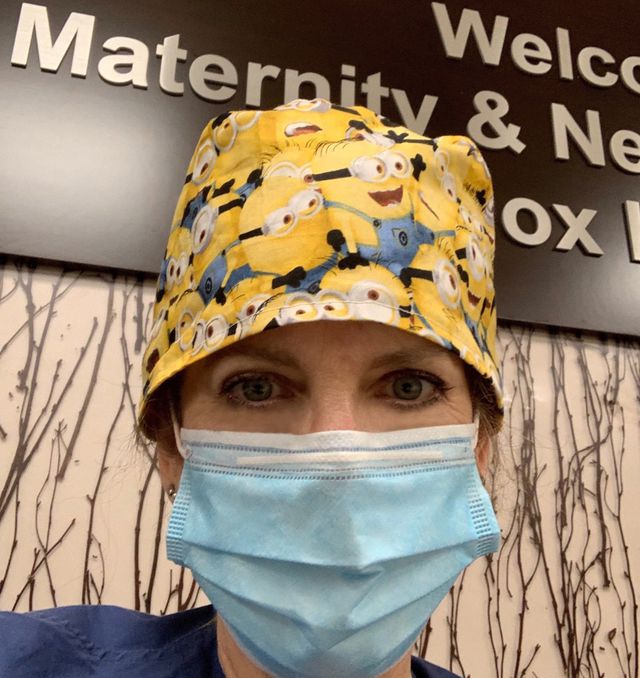 A selfie of Claire Panke, who is wearing a Minions cap and a mask.